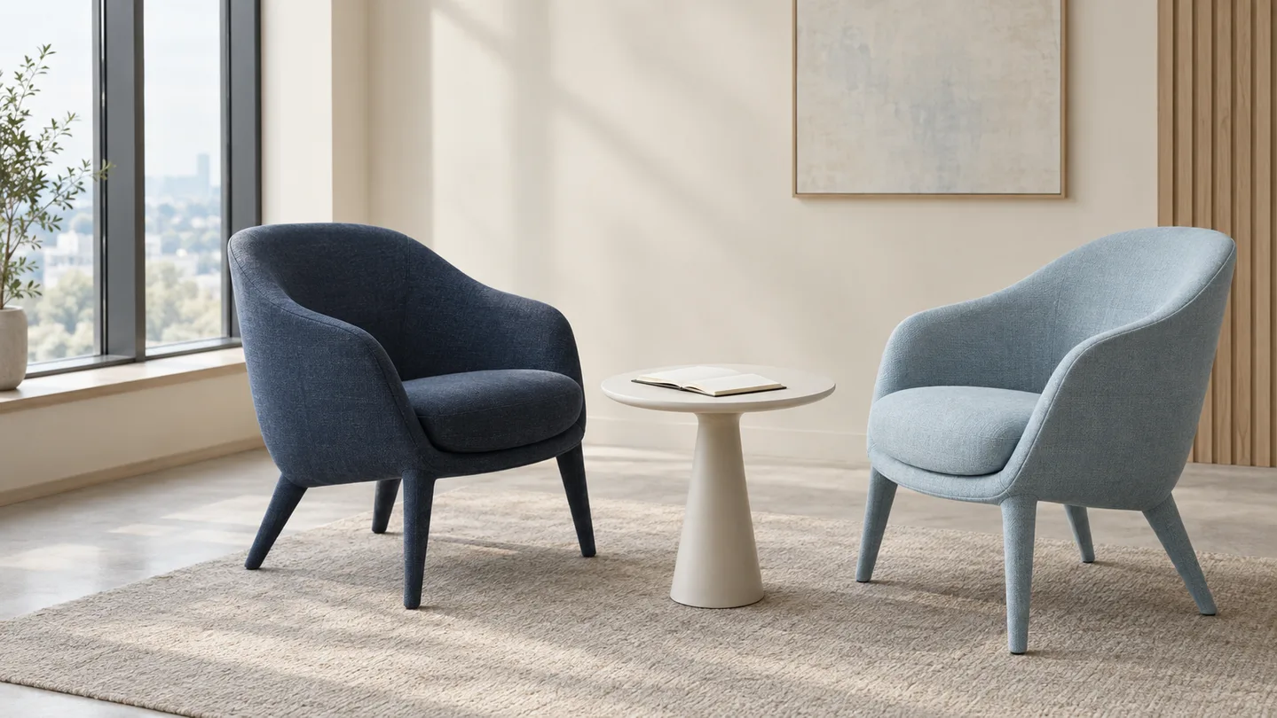 Two empty chairs facing one another in a quiet meeting room, an editorial illustration of making space for a conversation